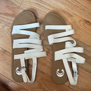 Women’s white/cream colored sandals.